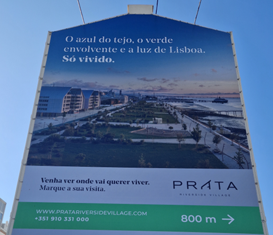 Publicity of the Prata Riverside Village in a public space. The marketing strategy is, “The blue from the Tagus, surrounded by the green and the light of Lisbon, just live it.” The appropriation of the riverfront view and the green area of the public Parque Ribeirinho do Oriente is evident in the valorization of this development. However, Marvila’s residents are not intended to live there (Source: Author, March 2023).